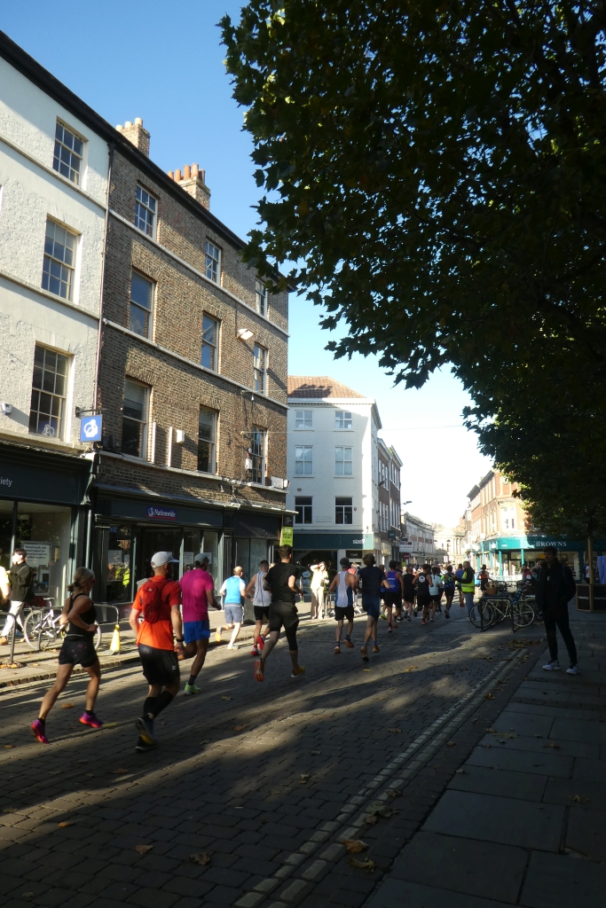 Real runners moving together during a road race